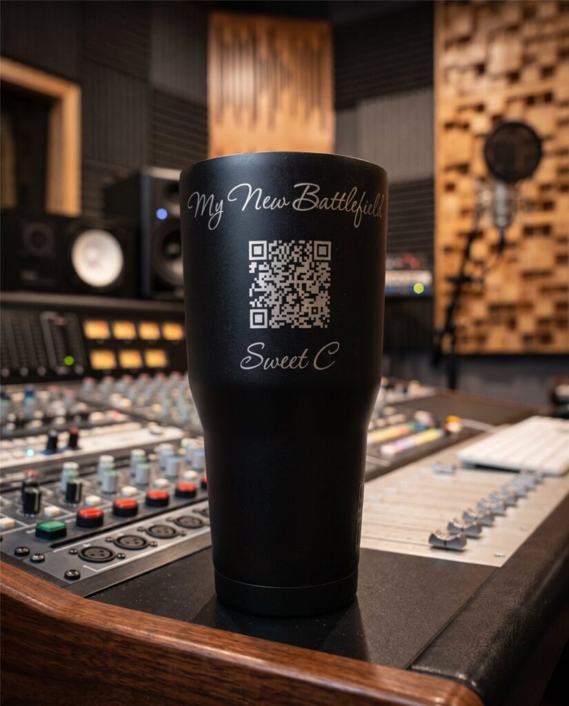 Black laser-engraved tumbler with a QR code and custom script text